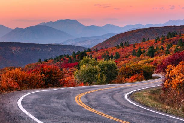 Ascolta e cammina.jpg Winding mountain road and autumn landscape with vibrant fall colors near Gunnison, Colorado.